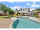 Gorgeous backyard featuring a pristine pool and lush greenery, perfect for outdoor enjoyment at 8545 E Heatherbrae Dr, Scottsdale, AZ 85251
