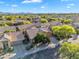 Beautiful home in a well-maintained community, surrounded by lush greenery and scenic mountain views at 9127 E Siesta Ln, Scottsdale, AZ 85255