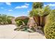 Backyard featuring a spa, tropical plants and privacy wall at 9127 E Siesta Ln, Scottsdale, AZ 85255