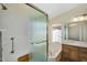 Well-lit bathroom with a glass-enclosed shower and soaking tub, with wood cabinets and bright lighting at 9127 E Siesta Ln, Scottsdale, AZ 85255