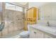 Bright bathroom featuring a tub with grab bars, and ample storage at 9127 E Siesta Ln, Scottsdale, AZ 85255