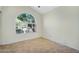 Spare bedroom featuring tile flooring and window to the front yard at 9127 E Siesta Ln, Scottsdale, AZ 85255
