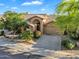 Charming single-story home with a well-manicured yard, desert landscaping, and attached two car garage at 9127 E Siesta Ln, Scottsdale, AZ 85255