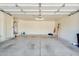 Spacious garage with ample storage space and a convenient side door at 9127 E Siesta Ln, Scottsdale, AZ 85255