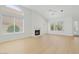 Bright and spacious living room features a fireplace, vaulted ceilings, and lots of natural light at 9127 E Siesta Ln, Scottsdale, AZ 85255