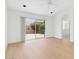 Bright living room features recessed lights, wood floors, and sliding glass doors to the private patio at 9127 E Siesta Ln, Scottsdale, AZ 85255