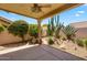 Covered patio with desert landscaping providing a tranquil outdoor space at 9127 E Siesta Ln, Scottsdale, AZ 85255