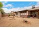 Backyard with desert landscaping and a covered patio area at 9511 W Carol Ave, Peoria, AZ 85345
