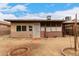 Cozy home backyard with a screened-in porch, gravel landscape, and ample space for outdoor activities at 9511 W Carol Ave, Peoria, AZ 85345