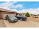 Single-story brick home featuring a two-car garage, desert landscaping, and driveway parking at 9511 W Carol Ave, Peoria, AZ 85345