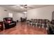 Inviting living room featuring tile flooring, a ceiling fan, and comfortable seating arrangement at 9511 W Carol Ave, Peoria, AZ 85345