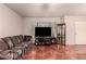 Bright living room featuring tile flooring, a ceiling fan, and a comfortable seating area at 9511 W Carol Ave, Peoria, AZ 85345