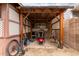 Outdoor covered patio area with a small barbecue grill and bicycle at 9511 W Carol Ave, Peoria, AZ 85345