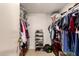 Walk-in closet featuring built-in organizers for shoes, clothes and other personal items at 9511 W Carol Ave, Peoria, AZ 85345