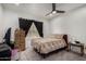 Cozy bedroom featuring a ceiling fan, blackout curtains, and comfortable furniture at 10101 N Arabian Trl # 2018, Scottsdale, AZ 85258
