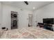 Bright bedroom features a ceiling fan, closet, and TV at 10101 N Arabian Trl # 2018, Scottsdale, AZ 85258