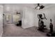 Bonus room with exercise equipment and access to the main living room at 10101 N Arabian Trl # 2018, Scottsdale, AZ 85258