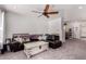 Spacious living room with neutral walls, a fireplace and open access to the kitchen at 10101 N Arabian Trl # 2018, Scottsdale, AZ 85258
