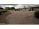 Expansive gravel backyard enclosed by a block wall, offering a private and low-maintenance outdoor space at 11022 S Iroquois Dr, Phoenix, AZ 85044