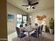 Inviting dining area featuring natural light, stylish furnishings, and access to the backyard at 11022 S Iroquois Dr, Phoenix, AZ 85044