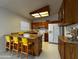 Functional kitchen featuring wood cabinets, breakfast bar, and essential appliances at 11022 S Iroquois Dr, Phoenix, AZ 85044