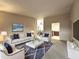 Bright living room featuring modern decor, plush seating, and neutral color palette at 11022 S Iroquois Dr, Phoenix, AZ 85044