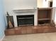 Cozy fireplace features tile surround and built-in shelving at 11052 N 10Th Pl, Phoenix, AZ 85020