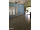 Bright living room features tile flooring, ceiling fan, and access to the outdoor space at 11052 N 10Th Pl, Phoenix, AZ 85020