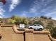 Street view of a home showcasing nearby mountain views and a parked car at 11052 N 10Th Pl, Phoenix, AZ 85020