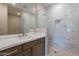 Spa-like bathroom boasting a glass-enclosed shower with marble-style tile and fixtures at 11300 N Casa Dega Dr # 1081, Surprise, AZ 85388