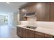 Modern kitchen featuring quartz countertops, wood floors and an electric cooktop at 11300 N Casa Dega Dr # 1081, Surprise, AZ 85388