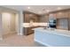 Modern kitchen with quartz island, stainless appliances, and stylish cabinetry at 11300 N Casa Dega Dr # 1081, Surprise, AZ 85388