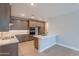 Stylish kitchen featuring modern appliances, quartz countertops, and ample cabinet space at 11300 N Casa Dega Dr # 1081, Surprise, AZ 85388