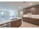 Spacious kitchen with a kitchen island, electric cooktop and an open floor plan at 11300 N Casa Dega Dr # 1081, Surprise, AZ 85388