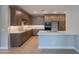 Contemporary kitchen with stainless steel appliances, quartz countertops, and abundant storage at 11300 N Casa Dega Dr # 1081, Surprise, AZ 85388