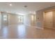 Spacious living room with light wood floors, neutral walls, and ample natural light at 11300 N Casa Dega Dr # 1081, Surprise, AZ 85388