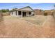 Spacious backyard with covered patio and low-maintenance desert landscaping at 1211 S Pueblo Ct, Gilbert, AZ 85233