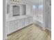 Bright bathroom with double vanity, tub, shower and modern lighting at 1211 S Pueblo Ct, Gilbert, AZ 85233
