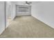 Spacious, carpeted bedroom with large window offering plenty of natural light at 1211 S Pueblo Ct, Gilbert, AZ 85233