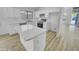 Bright kitchen boasts an island, quartz countertops, stainless steel appliances, and modern white cabinets at 1211 S Pueblo Ct, Gilbert, AZ 85233