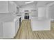 Modern kitchen features stainless steel appliances, quartz countertops, island, and ample cabinet space at 1211 S Pueblo Ct, Gilbert, AZ 85233