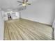 Spacious and bright living area with modern flooring and an open layout at 1211 S Pueblo Ct, Gilbert, AZ 85233