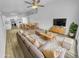 Bright living room with open floor plan, wood-look flooring, and modern furnishings at 1211 S Pueblo Ct, Gilbert, AZ 85233