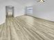 Spacious living area with wood-look floors and lots of natural light at 1211 S Pueblo Ct, Gilbert, AZ 85233