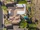 Expansive home featuring a private pool, lush landscaping, and a putting green in a desert community at 13249 E Summit Dr, Scottsdale, AZ 85259