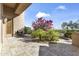 Charming outdoor patio area with stone pavers and manicured landscaping at 13249 E Summit Dr, Scottsdale, AZ 85259