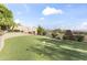 The backyard has a putting green, mature landscaping, and mountain views at 13249 E Summit Dr, Scottsdale, AZ 85259