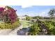 Well-manicured backyard featuring a putting green with beautiful desert landscaping and mountain views at 13249 E Summit Dr, Scottsdale, AZ 85259