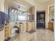 Luxurious bathroom with dual sinks, vanity, large mirror, and travertine flooring at 13249 E Summit Dr, Scottsdale, AZ 85259