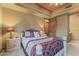 Cozy bedroom featuring a decorative ceiling and an en-suite bathroom with walk-in closet at 13249 E Summit Dr, Scottsdale, AZ 85259